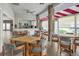 Community clubhouse with tables, chairs, and a kitchenette, perfect for gatherings and entertaining at 5814 Garden Lakes Fern, Bradenton, FL 34203