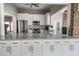 Bright kitchen features stainless steel appliances, white cabinets, and granite countertops at 5814 Garden Lakes Fern, Bradenton, FL 34203