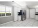 Bright kitchen featuring white cabinets, stainless steel appliances, and a window with natural light at 5814 Garden Lakes Fern, Bradenton, FL 34203
