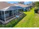 A birds eye view of a home with a screened-in porch that is perfect for relaxing and enjoying the outdoors at 5814 Garden Lakes Fern, Bradenton, FL 34203