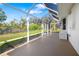 Open screened in porch overlooks yard at 5814 Garden Lakes Fern, Bradenton, FL 34203