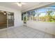 Bright sunroom with tile flooring, ceiling fan, and multiple windows that let in lots of natural light at 5814 Garden Lakes Fern, Bradenton, FL 34203