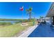 Well-maintained backyard offers a peaceful retreat with outdoor seating and waterfront scenery at 603 Ravenna N St, Nokomis, FL 34275