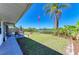 Private backyard featuring a seating area, fire pit, and easy access to waterfront activities at 603 Ravenna N St, Nokomis, FL 34275