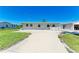 Charming single-story home with a well-maintained lawn and a spacious concrete driveway at 603 Ravenna N St, Nokomis, FL 34275