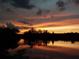 Amazing sunset reflecting in the water creates a tranquil setting for waterfront living at 603 Ravenna N St, Nokomis, FL 34275