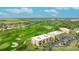 Gorgeous aerial view of the community with golf course, pond, and meticulously maintained grounds at 6124 43Rd W St # 404A, Bradenton, FL 34210