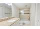 Bathroom features granite countertop vanity and a shower with glass door at 6124 43Rd W St # 404A, Bradenton, FL 34210