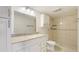 Tiled bathroom features a granite vanity and tiled walk-in shower at 6124 43Rd W St # 404A, Bradenton, FL 34210