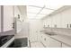 Kitchen features white cabinets, appliances, and ample counter space at 6124 43Rd W St # 404A, Bradenton, FL 34210