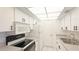 Bright kitchen featuring sleek countertops, white cabinetry and modern appliances at 6124 43Rd W St # 404A, Bradenton, FL 34210