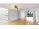 Bright living room with hardwood floors and sliding door to the balcony at 6124 43Rd W St # 404A, Bradenton, FL 34210