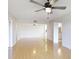 Bright living area with laminate floors, ceiling fan, and an open floor plan at 6124 43Rd W St # 404A, Bradenton, FL 34210
