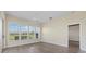 Bright bedroom with plantation shutters and views of the manicured landscaping at 6766 Greenview Ln, Englewood, FL 34224