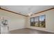 Well-lit bedroom showcasing decorative crown molding and plantation shutters at 6766 Greenview Ln, Englewood, FL 34224