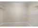 Spacious walk-in closet with built-in shelving for optimal storage solutions at 6766 Greenview Ln, Englewood, FL 34224