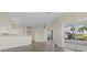 Inviting open-concept space with bar seating and seamless transition to lanai at 6766 Greenview Ln, Englewood, FL 34224
