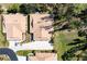 Aerial view of homes with well-maintained lawns, driveways, and tile roofs in a residential area at 7183 Wood Creek Dr # 9, Sarasota, FL 34231
