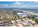 Beautiful aerial view of a neighborhood with mature trees and a waterway in the distance at 7183 Wood Creek Dr # 9, Sarasota, FL 34231