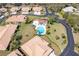 Aerial view of a community with pool, well-maintained homes, and mature landscaping at 7183 Wood Creek Dr # 9, Sarasota, FL 34231