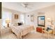 Cozy bedroom with tiled floors, queen bed, and neutral decor at 7183 Wood Creek Dr # 9, Sarasota, FL 34231