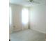Simple bedroom with updated flooring, a ceiling fan, and natural light from the window at 7183 Wood Creek Dr # 9, Sarasota, FL 34231
