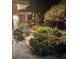 Inviting front yard featuring lush landscaping and a cozy seating area at the front of the home at 7183 Wood Creek Dr # 9, Sarasota, FL 34231