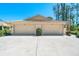 Attached two-car garage with ample parking in the driveway of this inviting home at 7183 Wood Creek Dr # 9, Sarasota, FL 34231