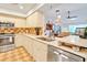 Well-maintained kitchen features stainless steel appliances and view to an open living space at 7183 Wood Creek Dr # 9, Sarasota, FL 34231