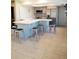 Open kitchen featuring a large island with seating, and stainless steel appliances at 7183 Wood Creek Dr # 9, Sarasota, FL 34231