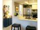 Updated kitchen features modern appliances, and breakfast bar at 7183 Wood Creek Dr # 9, Sarasota, FL 34231