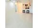 Bright living room with open floor plan, pendant lights, breakfast bar, and tile floors at 7183 Wood Creek Dr # 9, Sarasota, FL 34231