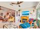 Cozy living room featuring a fireplace, large windows, and comfortable seating at 7183 Wood Creek Dr # 9, Sarasota, FL 34231