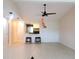 Bright living room with open floor plan, pendant lights, breakfast bar, and tile floors at 7183 Wood Creek Dr # 9, Sarasota, FL 34231