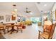 Bright living space featuring vaulted ceilings, tile floors, and stylish furnishings at 7183 Wood Creek Dr # 9, Sarasota, FL 34231