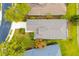 A high angle view showing the house's roof, driveway, and well-maintained landscaping at 7351 Meeting St, Bradenton, FL 34201