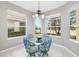 Cozy breakfast nook surrounded by windows, offering scenic water views and an abundance of natural light at 7351 Meeting St, Bradenton, FL 34201