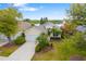Charming home boasting lush landscaping, a two-car garage, and picturesque lake views at 7351 Meeting St, Bradenton, FL 34201