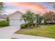 Charming single-story home with well-manicured lawn and professional tropical landscaping at 7351 Meeting St, Bradenton, FL 34201