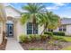 Charming front view of the home with a lush, tropical landscaped garden at 7351 Meeting St, Bradenton, FL 34201