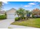 Charming home with a well manicured lawn and beautiful tropical landscaping at 7351 Meeting St, Bradenton, FL 34201