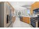 Well-lit kitchen featuring stainless steel appliances, light wood cabinets, and a breakfast nook at 7351 Meeting St, Bradenton, FL 34201