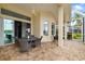Covered outdoor patio area for relaxing with table and seating; overlooking garden at 7351 Meeting St, Bradenton, FL 34201