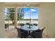 Enclosed outdoor lanai with brick flooring, ceiling fan, and waterfront views, ideal for relaxing at 7351 Meeting St, Bradenton, FL 34201