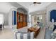 Open-concept living room with tile flooring, water view, and elegant furniture perfect for entertaining at 7351 Meeting St, Bradenton, FL 34201