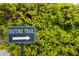 Image of the community's nature trail sign surrounded by lush greenery at 7351 Meeting St, Bradenton, FL 34201