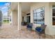 Brick-paved patio with seating area and views of the pond, perfect for outdoor relaxation at 7351 Meeting St, Bradenton, FL 34201