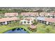 Aerial view of community, pool, and pond at 756 Avenida Estancia # 162, Venice, FL 34292