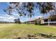 Spacious lawn area offering open green space behind condo building at 756 Avenida Estancia # 162, Venice, FL 34292
