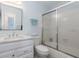 Bathroom featuring walk-in shower, vanity, and neutral paint at 756 Avenida Estancia # 162, Venice, FL 34292